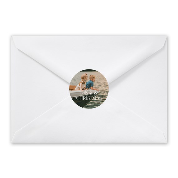 white envelope with photo sticker and text