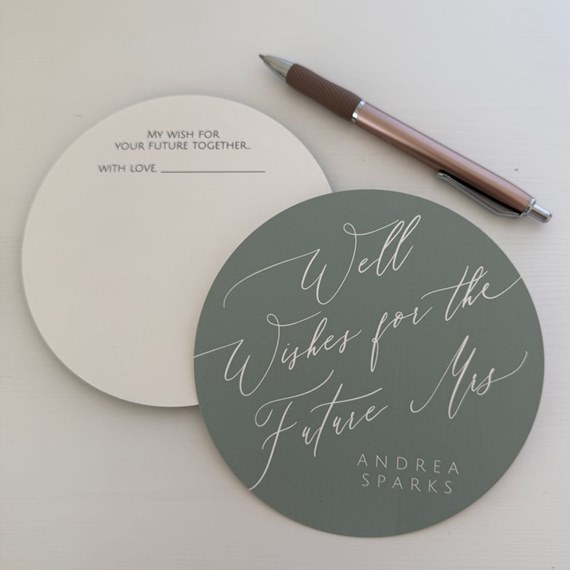 round wedding advice card with green background and white text