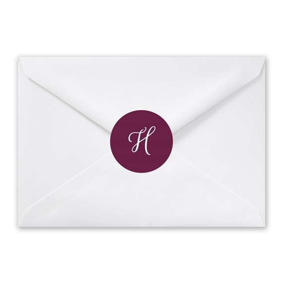 white envelope with burgundy seal and white letter H
