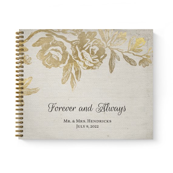 floral guest book with gold foil design and black text