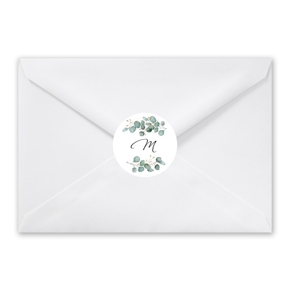 white envelope with circular eucalyptus seal and letter M