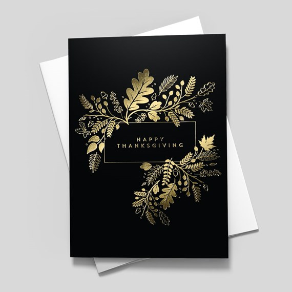 black card with gold floral designs and text area