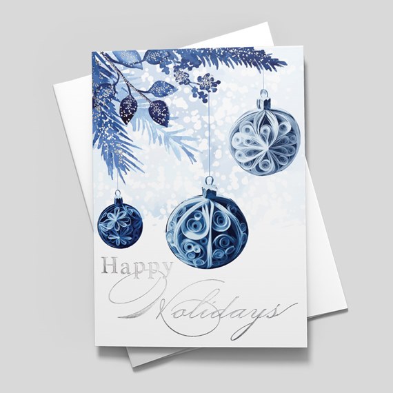 holiday card with blue ornaments and silver text