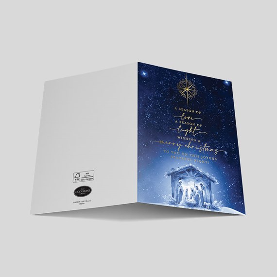 nativity scene card with starry background and gold foil text
