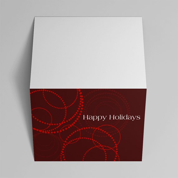 Square holiday greeting card with white top and burgundy front, red dotted circle pattern and 'Happy Holidays' text