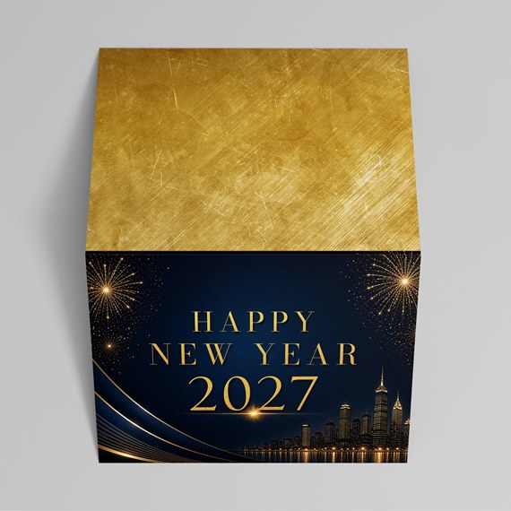 gold and blue decorative box with skyline and fireworks design