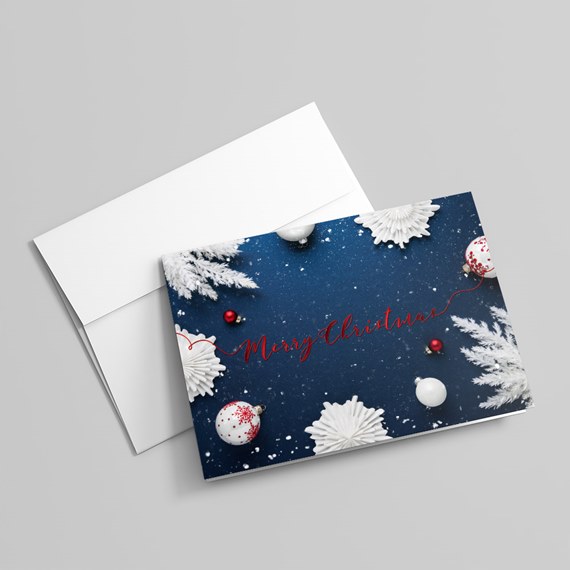 Navy Christmas greeting card with white ornaments, red baubles and 