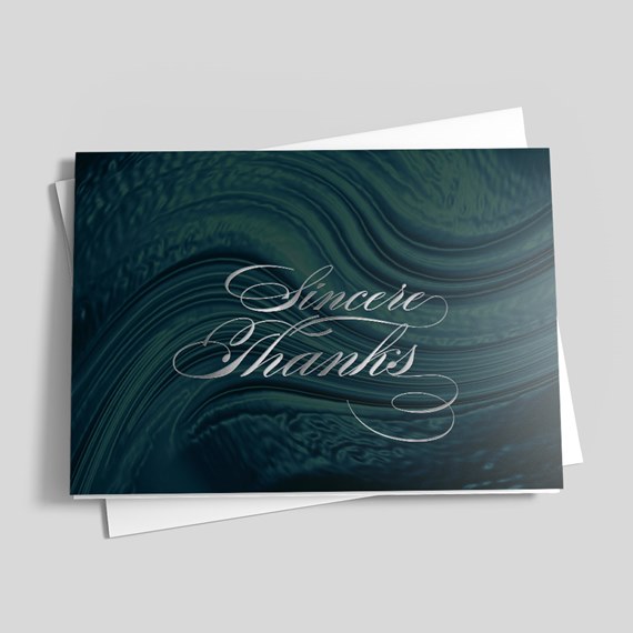 greeting card with marbled design and script text