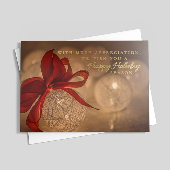 holiday card with ornaments and gold foil text