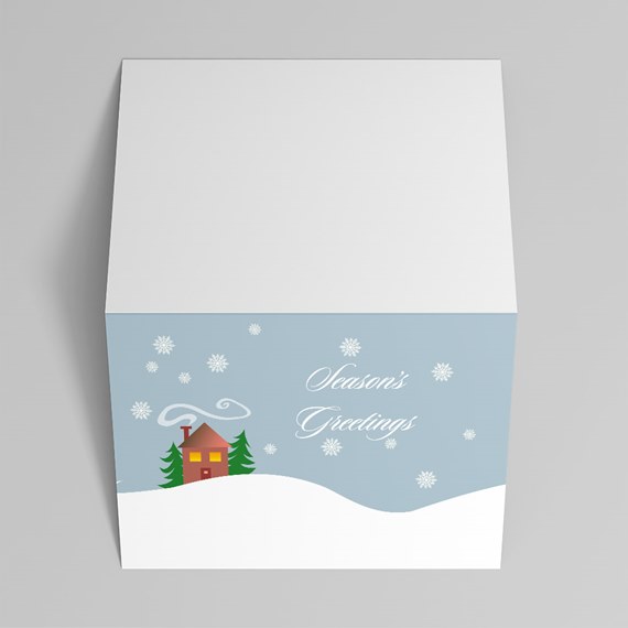 season's greetings card with house and snowflakes