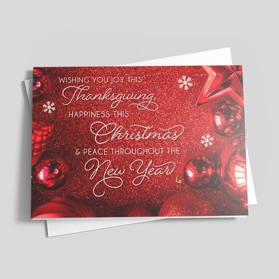 glittery red Christmas card with ornaments and white text