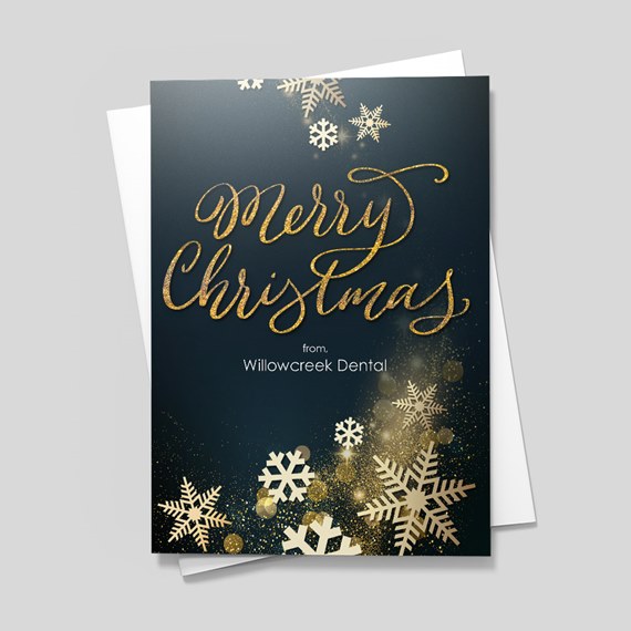 Christmas card with snowflakes and gold text