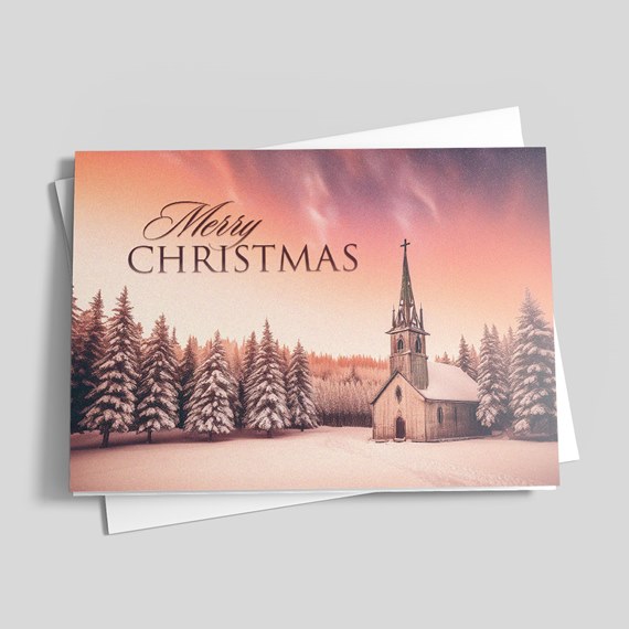 Folded Christmas card with snowy church, pine trees and 