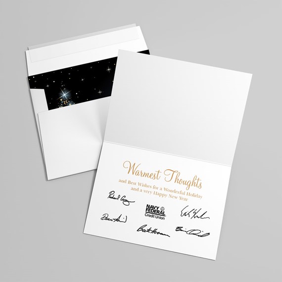 white greeting card with gold text and starry black envelope