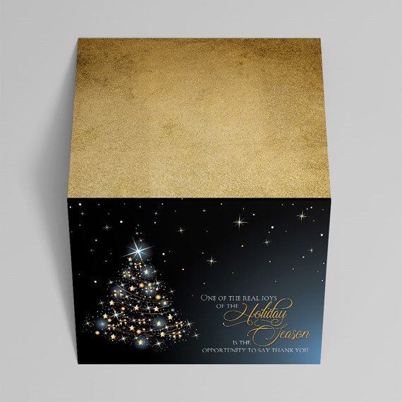 decorative box with Christmas tree design and gold top
