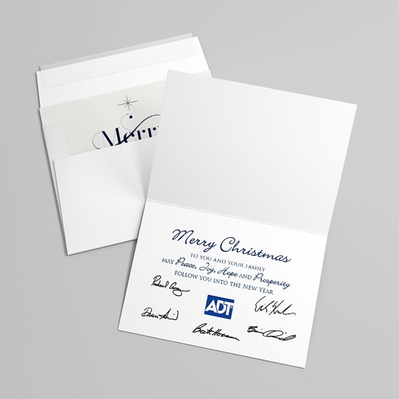 White folded Christmas greeting card with blue printed message, signatures and small blue logo with white envelope