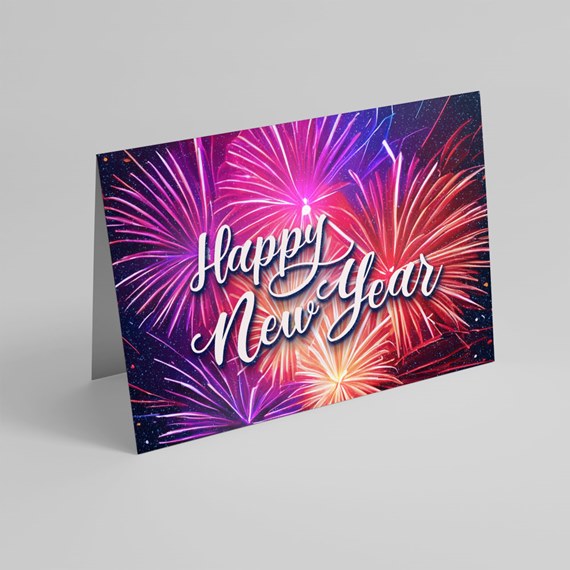 Folded Happy New Year greeting card with colorful fireworks illustration