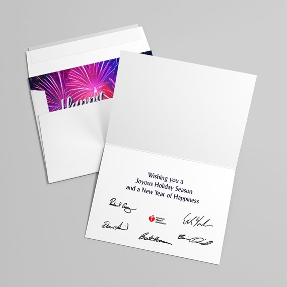 open folded holiday greeting card with printed message and signatures, envelope showing purple and pink fireworks liner