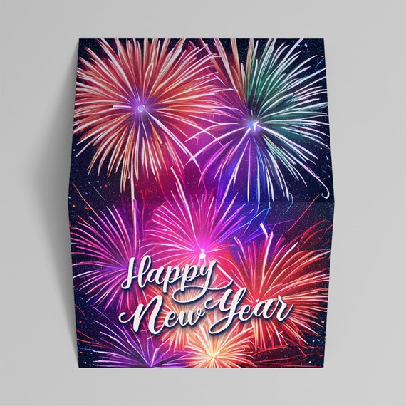 Folded card with colorful fireworks and "Happy New Year" lettering on a dark starry background