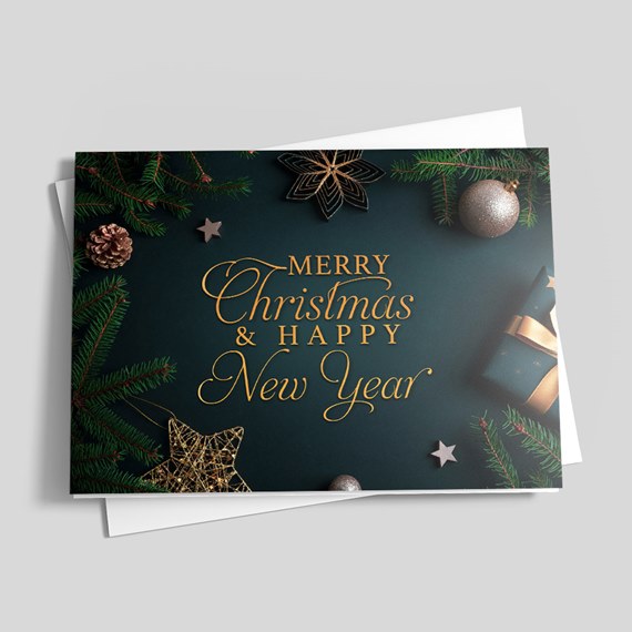 Folded Christmas and New Year greeting card with gold script on dark green background, fir branches, ornaments and gift