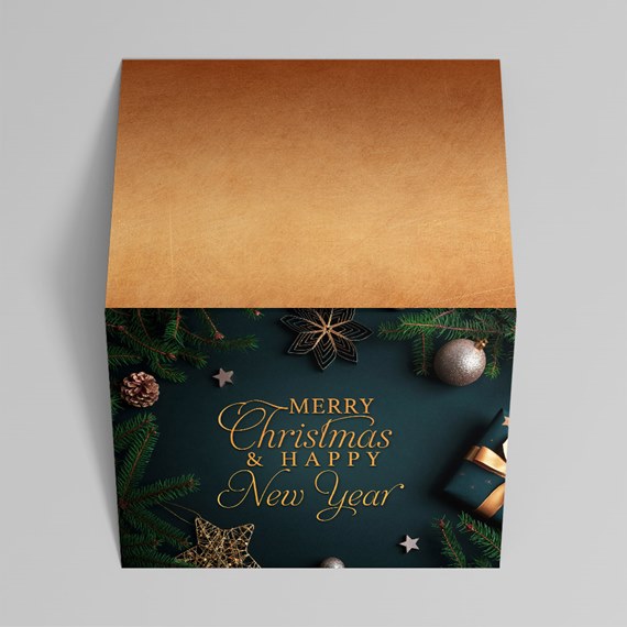 Folded dark green Christmas card with gold foil text 'Merry Christmas & Happy New Year', pine branch decorations, ornaments and a gold-toned interior flap