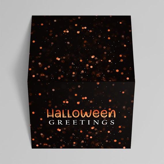 black box with bokeh effect and Halloween greetings text