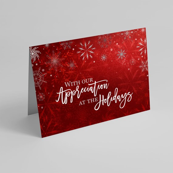 greeting card with snowflake design and holiday text