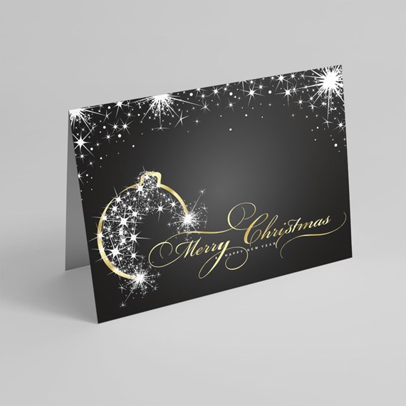 black card with sparkling ornament and gold text