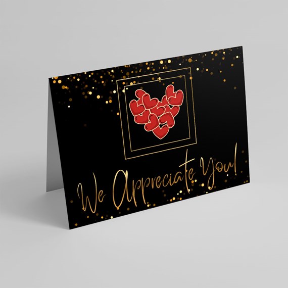 black card with golden glitter, red heart frame, gold text