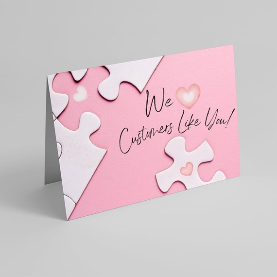 pink card with puzzle pieces and text