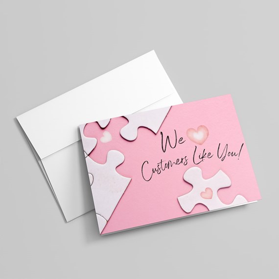 pink card with puzzle pieces and hearts, customizable text area