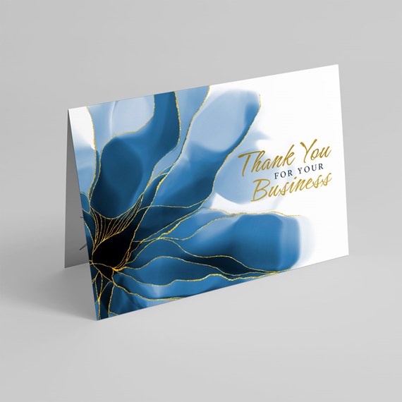 folded card with blue floral design and gold text