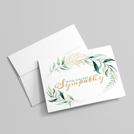 sympathy card with leaves and gold text, white envelope