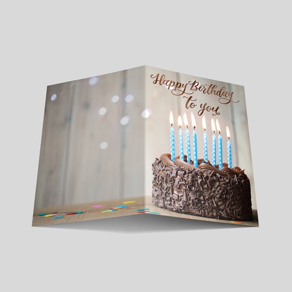 birthday card with chocolate cake and blue candles