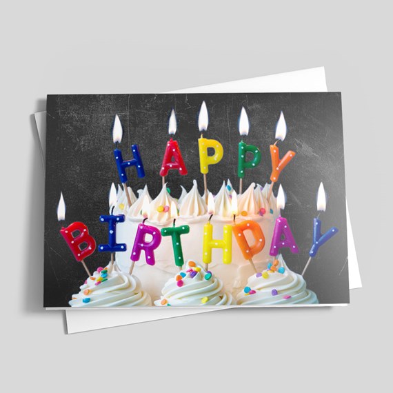 birthday cake with colorful candles and icing