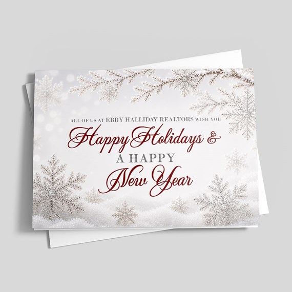 holiday card with silver snowflakes and red text