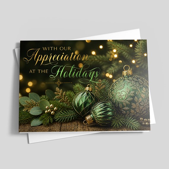 holiday card with green ornaments and greenery, customizable text area