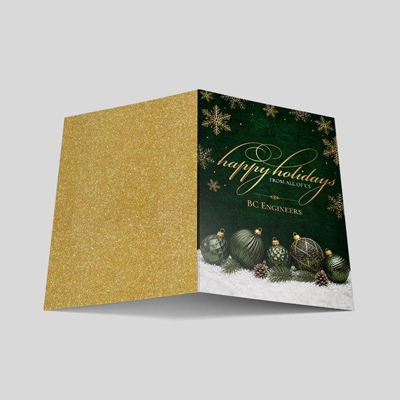 holiday card with gold glitter and green design, text area