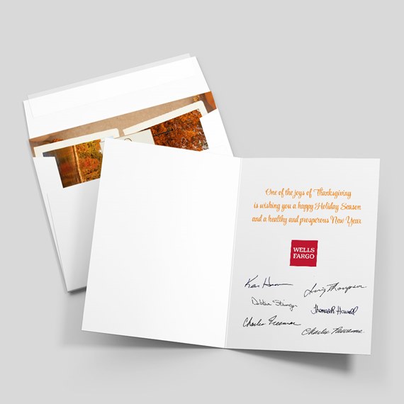 open greeting card with holiday message and signatures