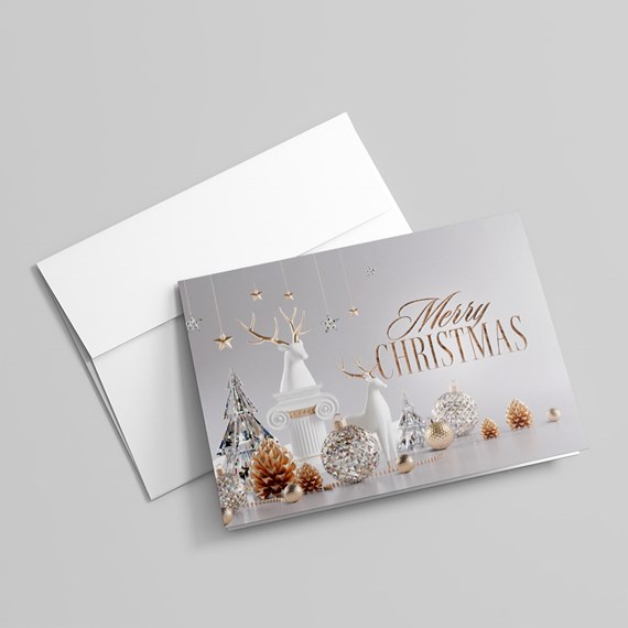 Christmas card with deer, trees, ornaments, and gold text