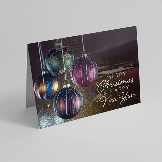 greeting card with Christmas ornaments and festive text