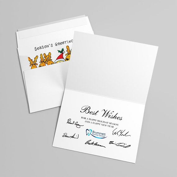 holiday card with reindeer illustration and printed message
