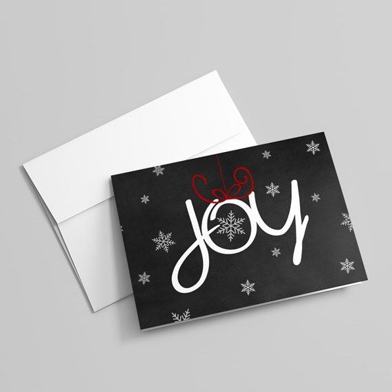 black card with joy text and snowflakes