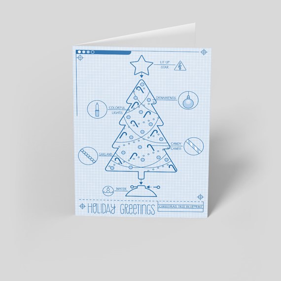Folded holiday greeting card with blueprint-style schematic Christmas tree illustration in blue on a light blue grid background