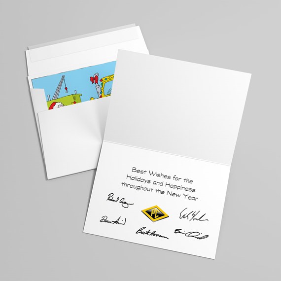 Folded white holiday greeting card and envelope with printed seasonal message, signatures, colorful cartoon insert and small yellow diamond emblem