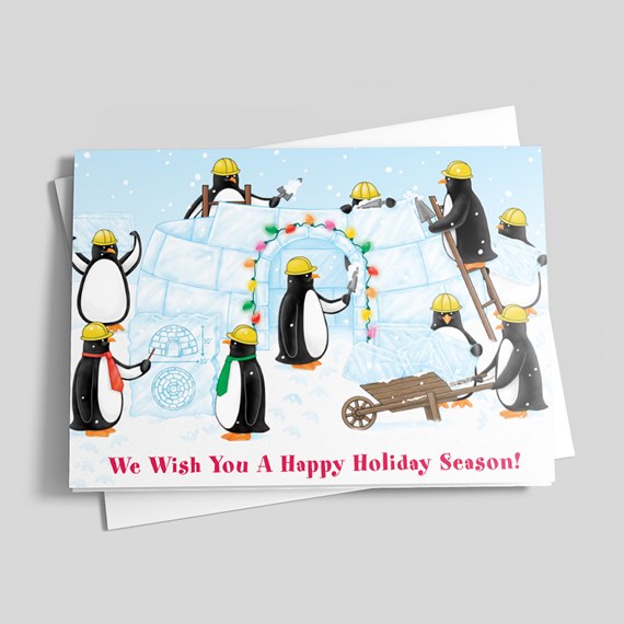 illustration of penguins building an igloo with holiday lights, text area