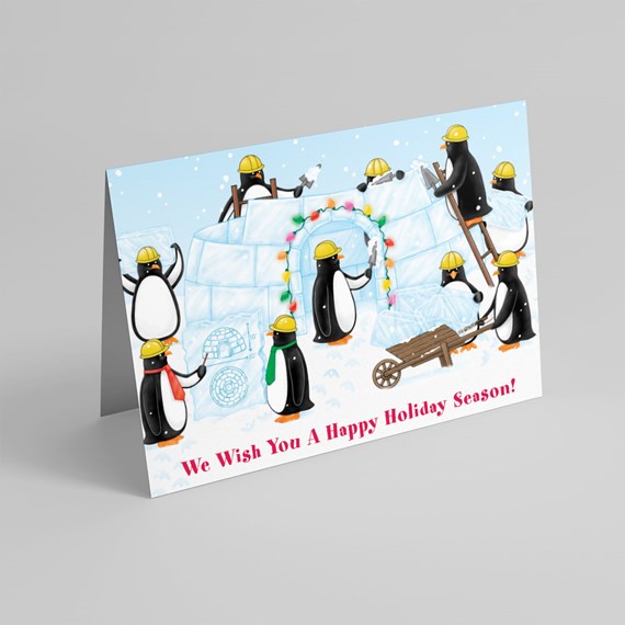 penguins building igloo with holiday lights
