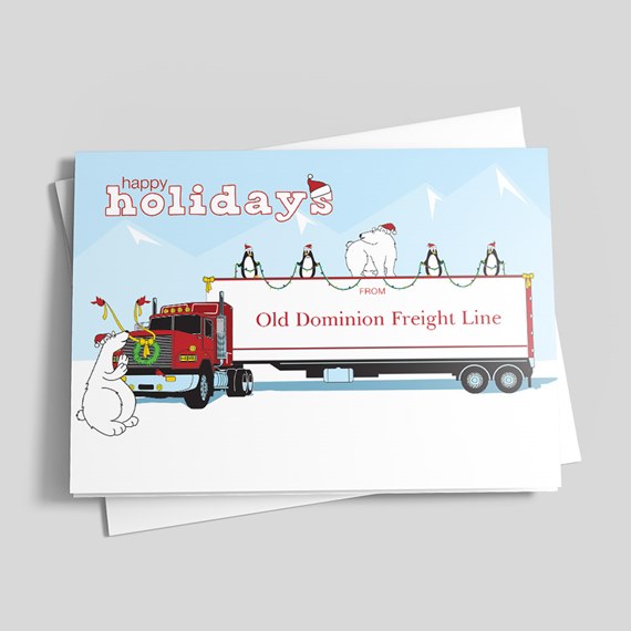 Holiday greeting card with red semi truck and decorated white trailer, penguins and polar bears wearing Santa hats