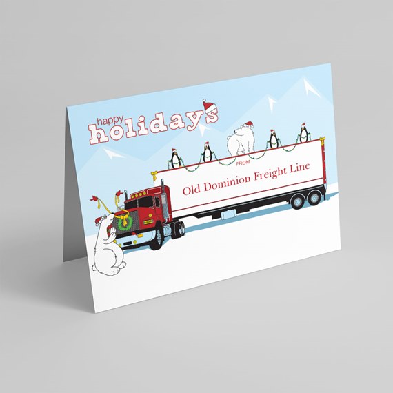 Folded holiday card with red semi-truck decorated with wreath and lights, penguins and polar bears on trailer against snowy mountains