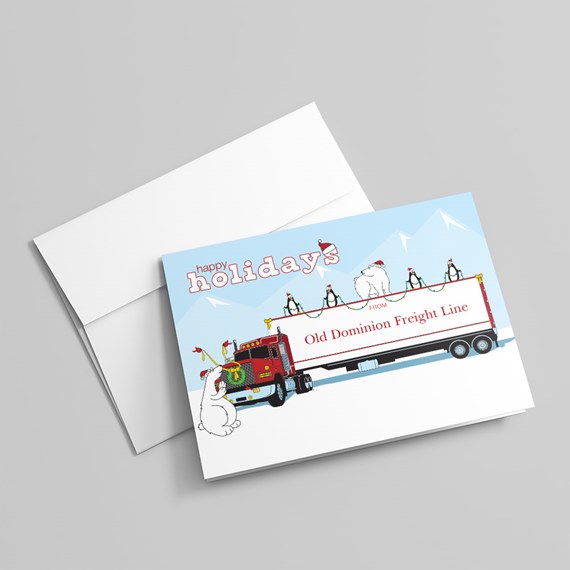 Holiday greeting card featuring an illustrated red semi truck and white trailer with penguins and polar bears in a snowy blue mountain scene.